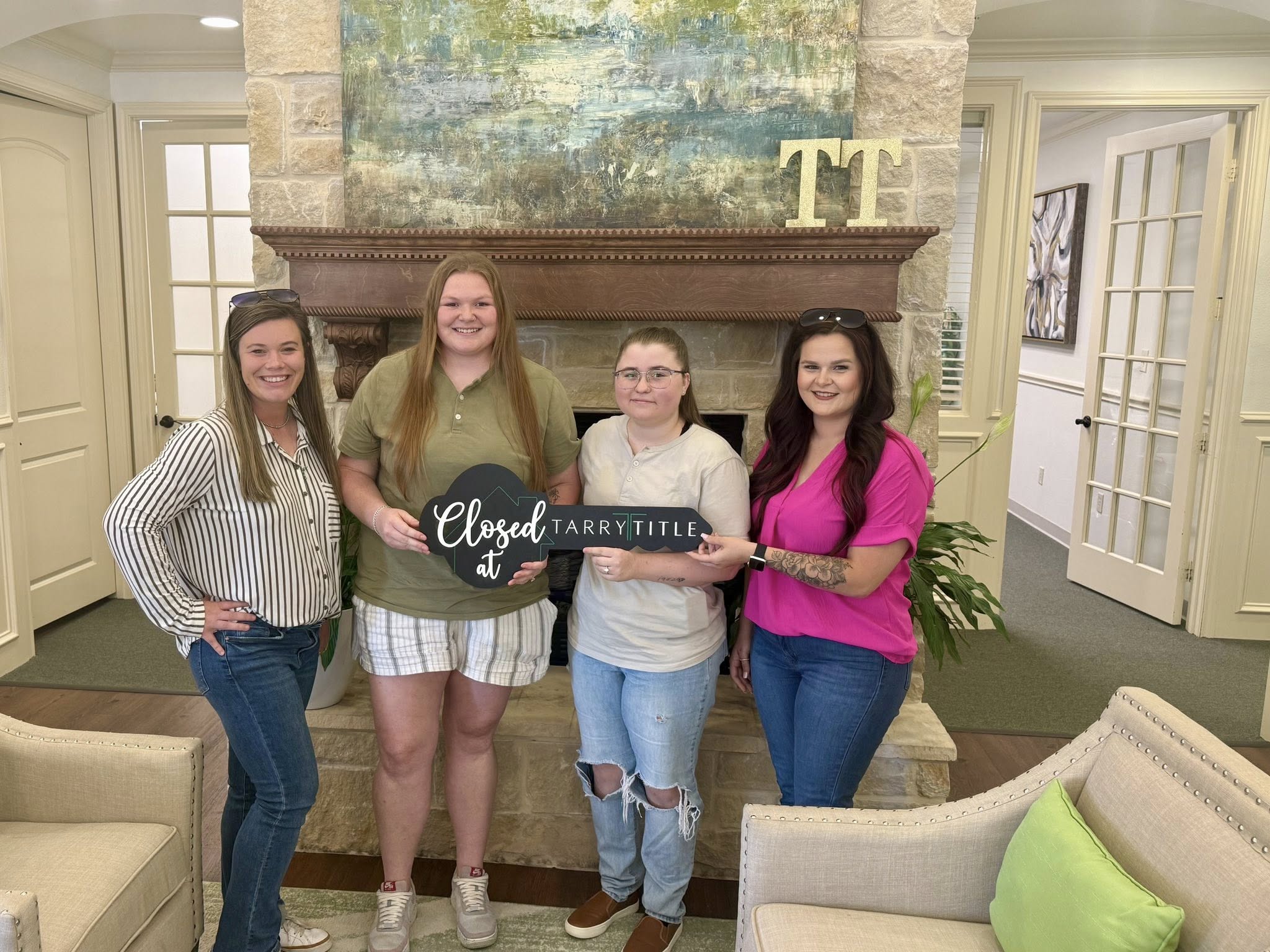 Kelly with happy clients at closing